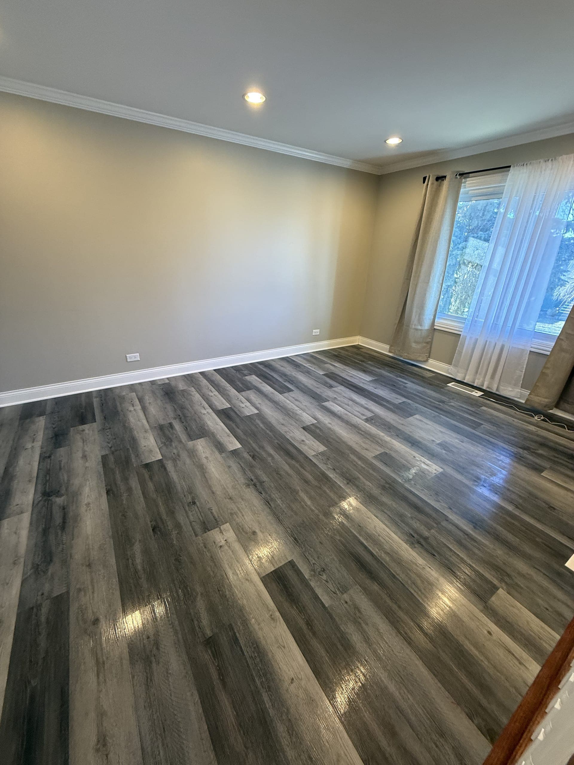 Living room with hardwood floors cleaned and polished in Plainfield IL